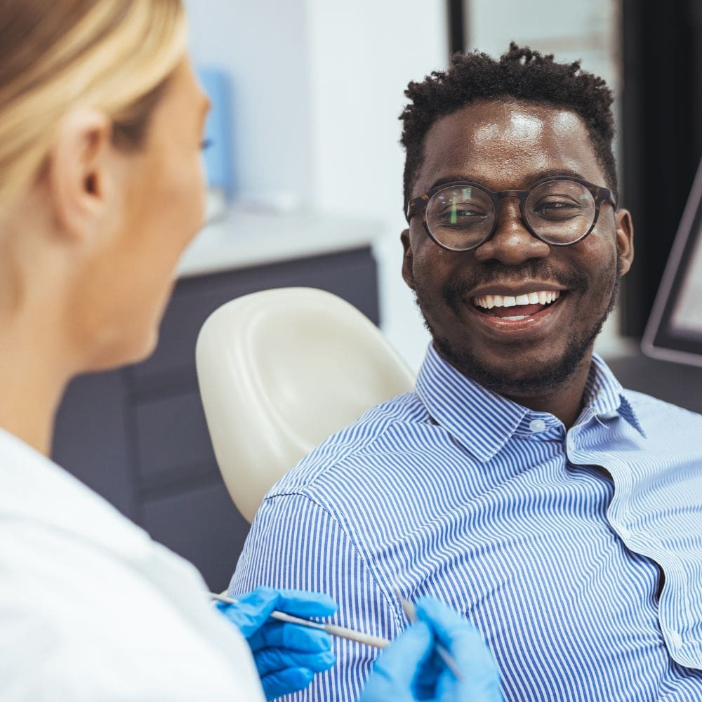 A patient receiving gentle, expert periodontal care at Thames Dental & Skin
