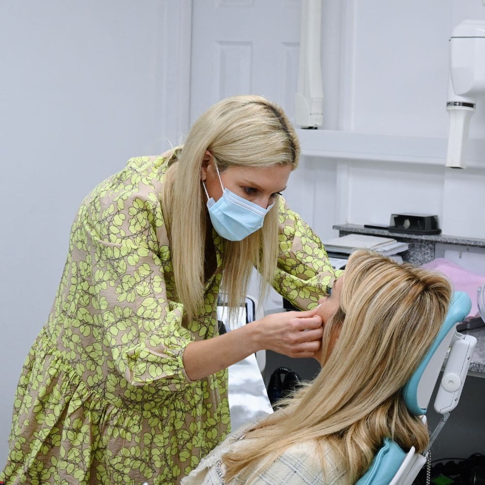 Dr Theodora Bravis consulting with a patient about Polynucleotides treatment at Thames Dental and Skin in Thames Ditton in Surrey