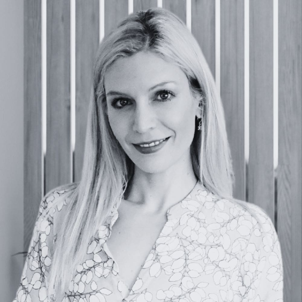 A headshot of Dr Theodora Bravis, founder and specialist prosthodontist at Thames Dental & Skin Clinic, dedicated to providing exceptional dental care and facial aesthetic treatments in Thames Ditton, Surrey.