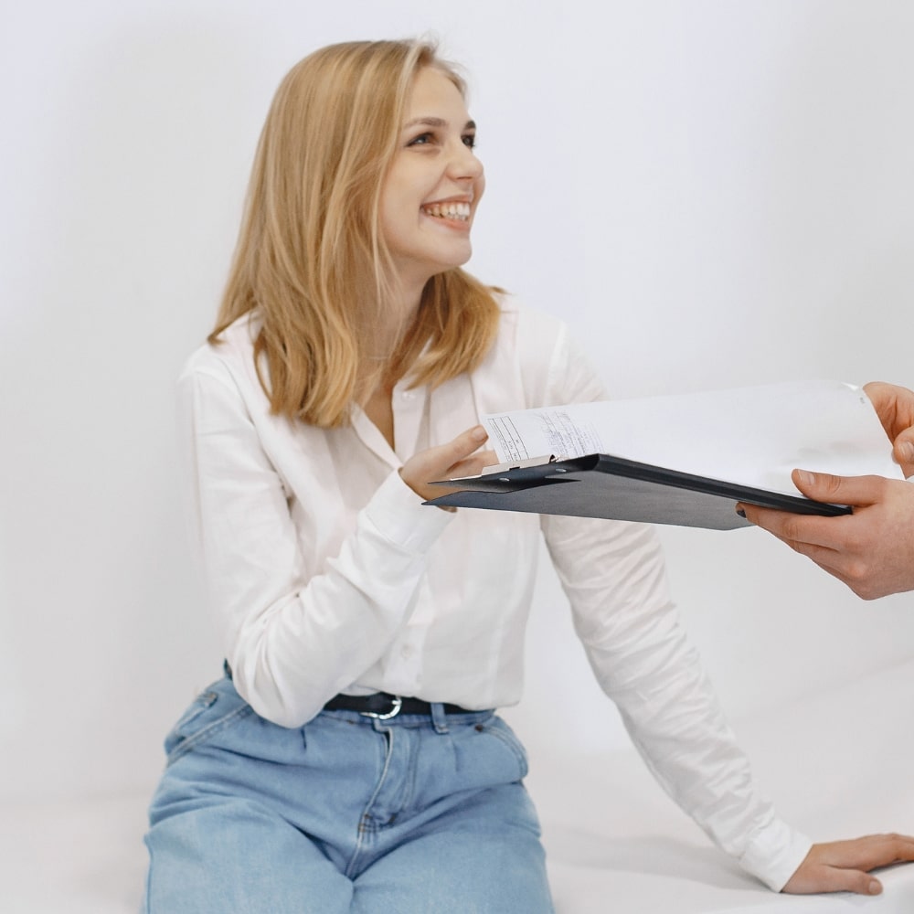 Female patient receiving a health and wellness consultation from Dr. Bravis at Thames Dental & Skin Clinic in Thames Ditton.